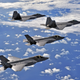Illustration for article titled Cool photos of F-22s and F-35s flying together for the first time